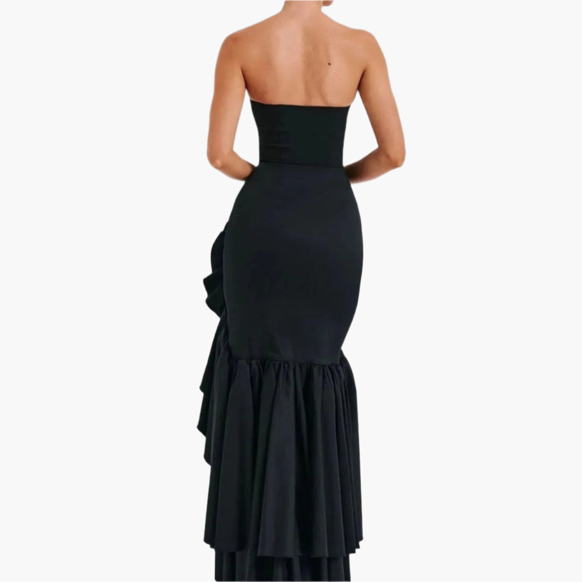 Back view of strapless dress showing  tiered ruffle detail.