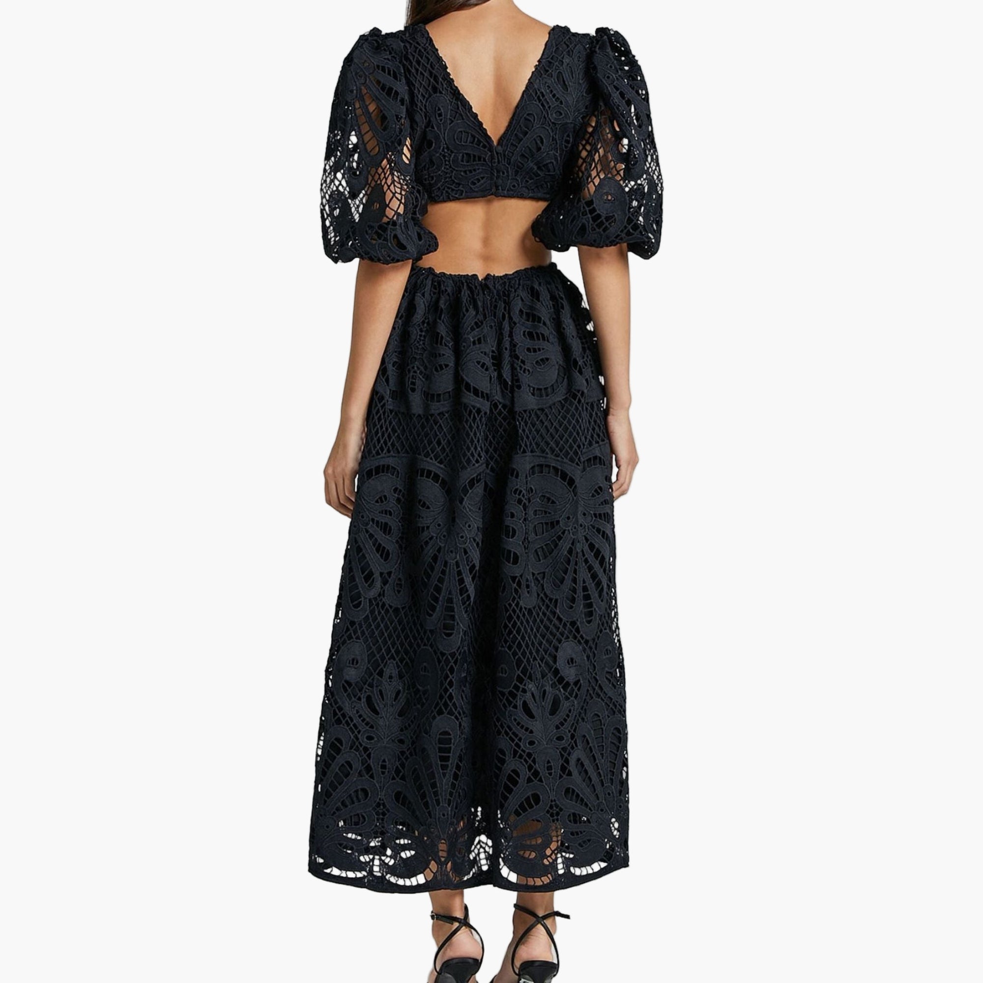 Model WEARING elegant lace dress with open back