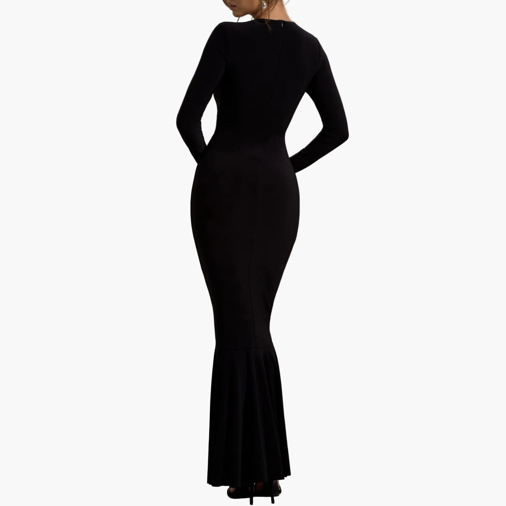 Back view of Black maxi dress with full-length sleeves and round neckline.