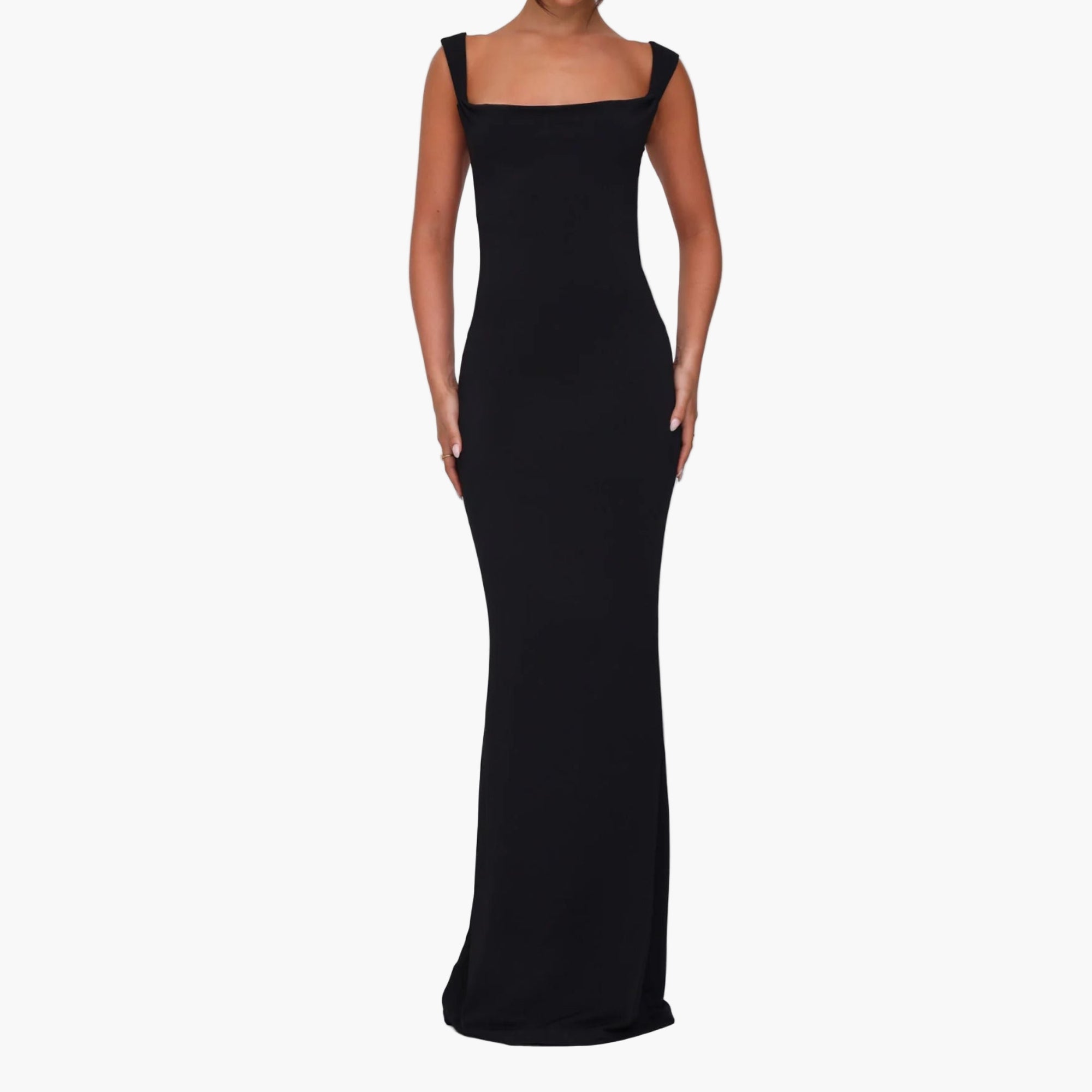 Model wearing backless bow-tie back maxi dress with 