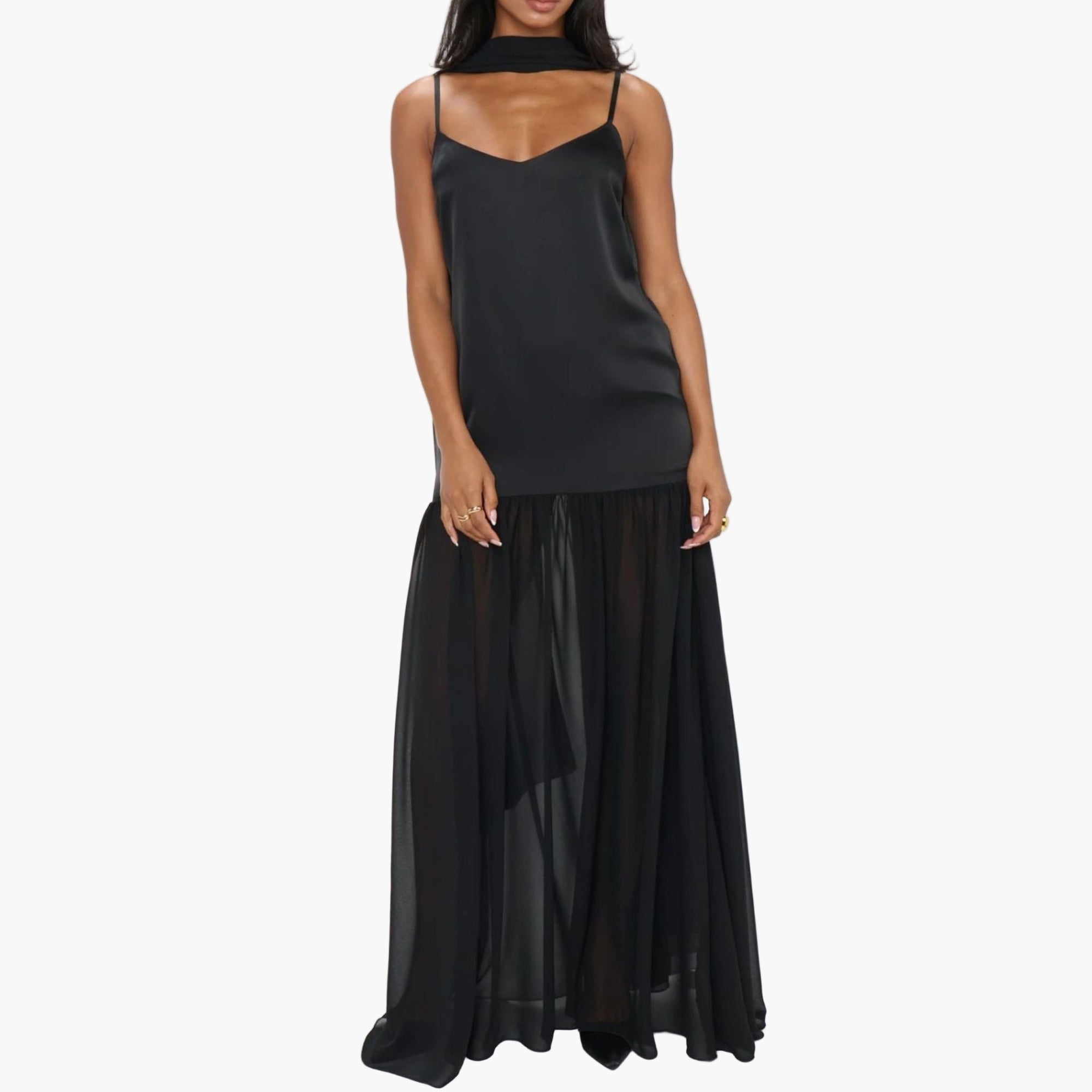 Model wearing a sheer mesh maxi dress with adjustable cami straps and matching scarf.
