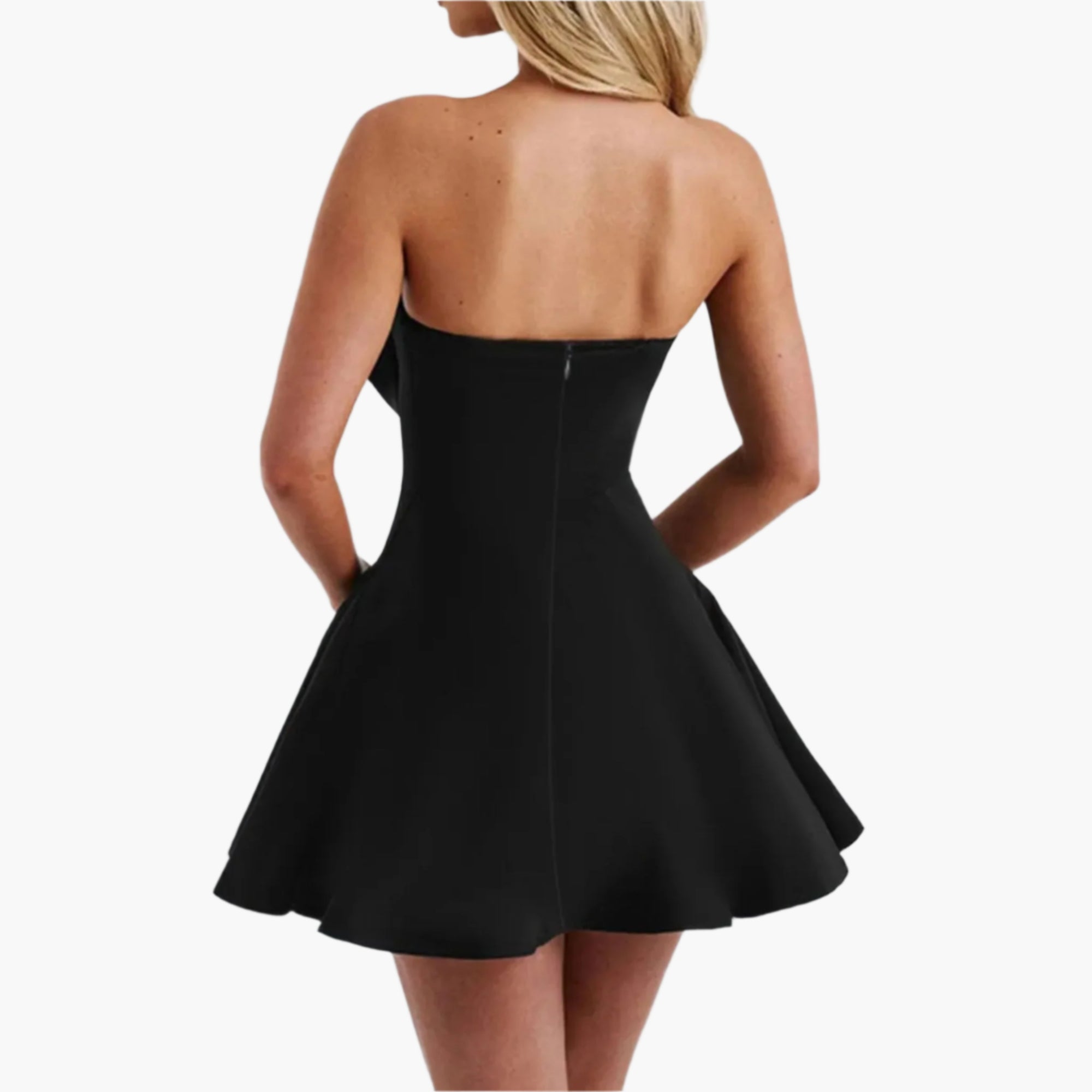 Back view of a strapless black dress with a visible zipper and oversized bow at the front